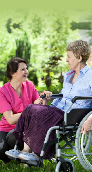 nurse and elderly woman in wheel chair